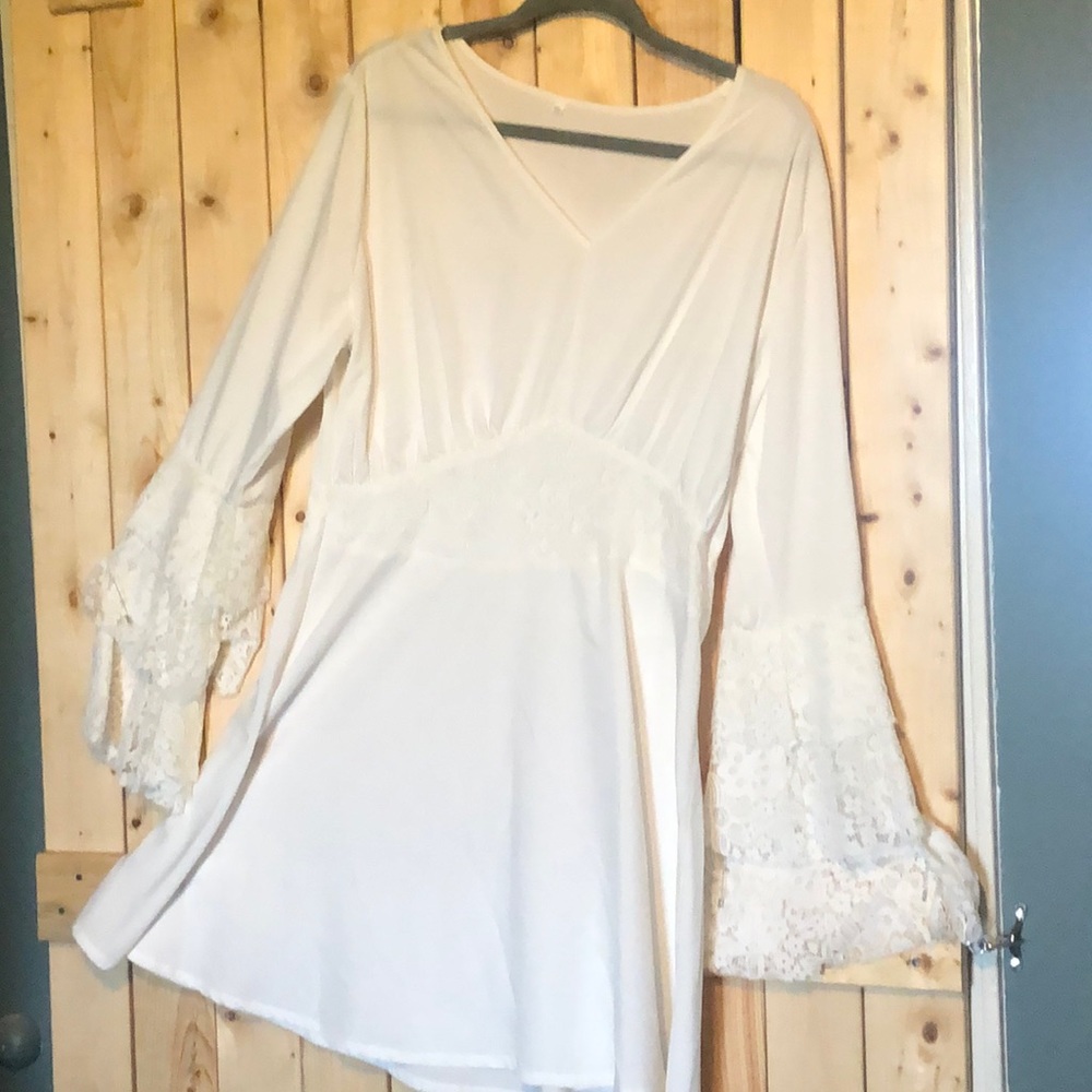 Beautiful white blouse with lace bell sleeves